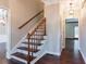 A view of the staircase in a home, featuring wooden steps and trim detail at 214 Jamestown Ave, Jonesboro, GA 30236