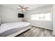 Bedroom features hardwood floors, a large window for natural light, and neutral walls at 3322 Northcrest Rd # A, Atlanta, GA 30340