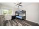 Bedroom boasts hardwood floors, a large window for natural light, and neutral walls at 3322 Northcrest Rd # A, Atlanta, GA 30340