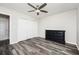 Bedroom features hardwood floors, neutral walls, a dresser, a closet, and a ceiling fan at 3322 Northcrest Rd # A, Atlanta, GA 30340