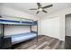 Bedroom offers hardwood floors, a closet, a large window for natural light, and a ceiling fan at 3322 Northcrest Rd # A, Atlanta, GA 30340