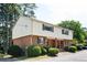 A charming two-story home with well-maintained landscaping and ample parking, showcasing its appealing curb appeal at 3322 Northcrest Rd # A, Atlanta, GA 30340