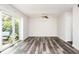 Bright living room with modern floor, and sliding glass doors for natural light and access to the outdoors at 3322 Northcrest Rd # A, Atlanta, GA 30340