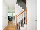 A staircase with wood treads and white risers ascends to the upper level, offering a view into the living room at 3322 Northcrest Rd # A, Atlanta, GA 30340