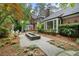 Stunning backyard with beautiful landscaping, stone pavers, fountain, and lush plantings at 905 Stovall Ne Blvd, Atlanta, GA 30319
