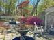 Relaxing backyard with outdoor seating, a bubbling fountain, beautiful flowers, and a pergola at 905 Stovall Ne Blvd, Atlanta, GA 30319