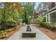 Serene backyard oasis features stone pavers, fountain, gazebo, and beautiful landscaping at 905 Stovall Ne Blvd, Atlanta, GA 30319