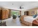 Large primary bedroom boasts sitting area, bay windows, and classic decor at 905 Stovall Ne Blvd, Atlanta, GA 30319