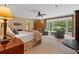 Spacious primary bedroom featuring a bay window, sitting area, and ensuite bathroom at 905 Stovall Ne Blvd, Atlanta, GA 30319