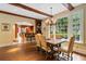 Inviting dining room boasts hardwood floors, view of backyard and access to the kitchen bar at 905 Stovall Ne Blvd, Atlanta, GA 30319