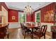 Dining room with chandelier, wood floor, striped wallpaper and several windows for lots of light at 905 Stovall Ne Blvd, Atlanta, GA 30319