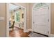 Inviting foyer featuring hardwood floors, white trim, and an arched doorway into a study at 905 Stovall Ne Blvd, Atlanta, GA 30319