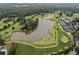 Scenic aerial view of a meticulously maintained golf course with lush greenery and a serene lake feature at 905 Stovall Ne Blvd, Atlanta, GA 30319