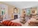 Elegant living room showcasing a fireplace, hardwood floors, classic seating, and ample natural light at 905 Stovall Ne Blvd, Atlanta, GA 30319