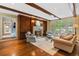 Living room with hardwood floors, fireplace, and two sets of French doors with access to the home's outdoor space at 905 Stovall Ne Blvd, Atlanta, GA 30319