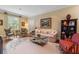 Bright living room featuring hardwood floors, a decorative rug, traditional furnishings, and natural light at 905 Stovall Ne Blvd, Atlanta, GA 30319