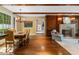 Living space featuring wood floors, a fireplace, wooden beams, and natural light from many windows at 905 Stovall Ne Blvd, Atlanta, GA 30319