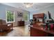 Bright home office with hardwood floors, natural light, and built-in cabinets at 905 Stovall Ne Blvd, Atlanta, GA 30319