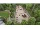 Overhead view of a neighborhood playground, featuring multiple play structures surrounded by trees at 905 Stovall Ne Blvd, Atlanta, GA 30319