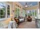 Charming sunroom with many windows, neutral carpet, traditional furniture, and attractive natural light at 905 Stovall Ne Blvd, Atlanta, GA 30319