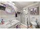 Bathroom features updated vanity, mirror, shower, toilet, and medicine cabinet at 1364 Keys Crossing Ne Dr, Atlanta, GA 30319