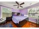 Bedroom with a ceiling fan and a window with blinds allowing plenty of sunlight at 1364 Keys Crossing Ne Dr, Atlanta, GA 30319