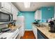 Bright kitchen with white cabinets, granite countertops, and stainless steel appliances, designed for functionality and style at 1364 Keys Crossing Ne Dr, Atlanta, GA 30319