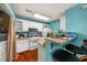 Efficient kitchen with white cabinets, breakfast bar, and stainless steel appliances, perfect for cooking and casual dining at 1364 Keys Crossing Ne Dr, Atlanta, GA 30319