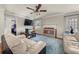 Bright living room with hardwood floors, fireplace, and stylish furnishings, offering a comfortable gathering space at 1364 Keys Crossing Ne Dr, Atlanta, GA 30319