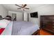 Bedroom featuring a ceiling fan, a flat-screen television, and a dresser at 1364 Keys Crossing Ne Dr, Atlanta, GA 30319