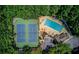 An aerial view of community amenities including the pool, tennis courts, green space, and clubhouse at 1850 Noblin Ridge Way, Duluth, GA 30097