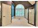 Bright bathroom featuring a large garden tub under an arched window, complemented by a separate glass shower at 1850 Noblin Ridge Way, Duluth, GA 30097