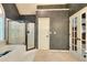 Bathroom featuring a large garden tub, a separate glass shower, and textured walls at 1850 Noblin Ridge Way, Duluth, GA 30097