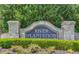A stone sign indicates the neighborhood is River Plantation, surrounded by manicured landscaping at 1850 Noblin Ridge Way, Duluth, GA 30097