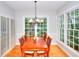 Traditional dining room with wood table, chairs, and a bright window view at 1850 Noblin Ridge Way, Duluth, GA 30097