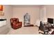 Home office with comfortable seating, a bookshelf with memorabilia, and computer desk at 1850 Noblin Ridge Way, Duluth, GA 30097