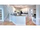 Bright kitchen with stainless steel appliances, hardwood floors, and breakfast bar seating area at 1850 Noblin Ridge Way, Duluth, GA 30097