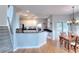 Open kitchen featuring stainless steel appliances, granite countertops, and breakfast bar with adjacent dining area at 1850 Noblin Ridge Way, Duluth, GA 30097
