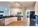 Well-lit kitchen with stainless steel appliances, hardwood floors, and granite countertops at 1850 Noblin Ridge Way, Duluth, GA 30097