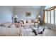 Cozy living room with soft furnishings, elegant lamps, and bright window shutters at 1850 Noblin Ridge Way, Duluth, GA 30097