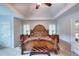 Large bedroom with tray ceiling and beautiful furniture at 1850 Noblin Ridge Way, Duluth, GA 30097