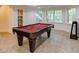 Recreation room featuring a pool table, large windows, and unique lighting at 314 Caruso Ct, Sandy Springs, GA 30350
