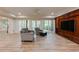 Finished basement showcasing a custom built-in entertainment center and plenty of natural light at 314 Caruso Ct, Sandy Springs, GA 30350