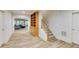 Finished basement with wood-look flooring, a built-in bookcase, and a staircase at 314 Caruso Ct, Sandy Springs, GA 30350