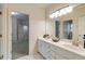 Bathroom featuring double sinks, ample counter space, and adjoining rooms at 314 Caruso Ct, Sandy Springs, GA 30350