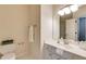 Clean bathroom with a white vanity, ample counter space, and a toilet at 314 Caruso Ct, Sandy Springs, GA 30350