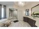 Bright bathroom featuring a glass shower, a soaking tub, and a dual vanity with marble countertops at 314 Caruso Ct, Sandy Springs, GA 30350