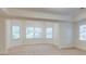 Bright and airy bedroom with natural light, neutral carpeting, and large windows offering scenic views at 314 Caruso Ct, Sandy Springs, GA 30350