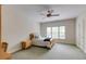 Cozy bedroom with carpeted floors, a ceiling fan, and a window letting in natural light at 314 Caruso Ct, Sandy Springs, GA 30350
