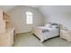 Well-lit bedroom with desk and chair, window with blinds, and light colored bed with decor pillows at 314 Caruso Ct, Sandy Springs, GA 30350